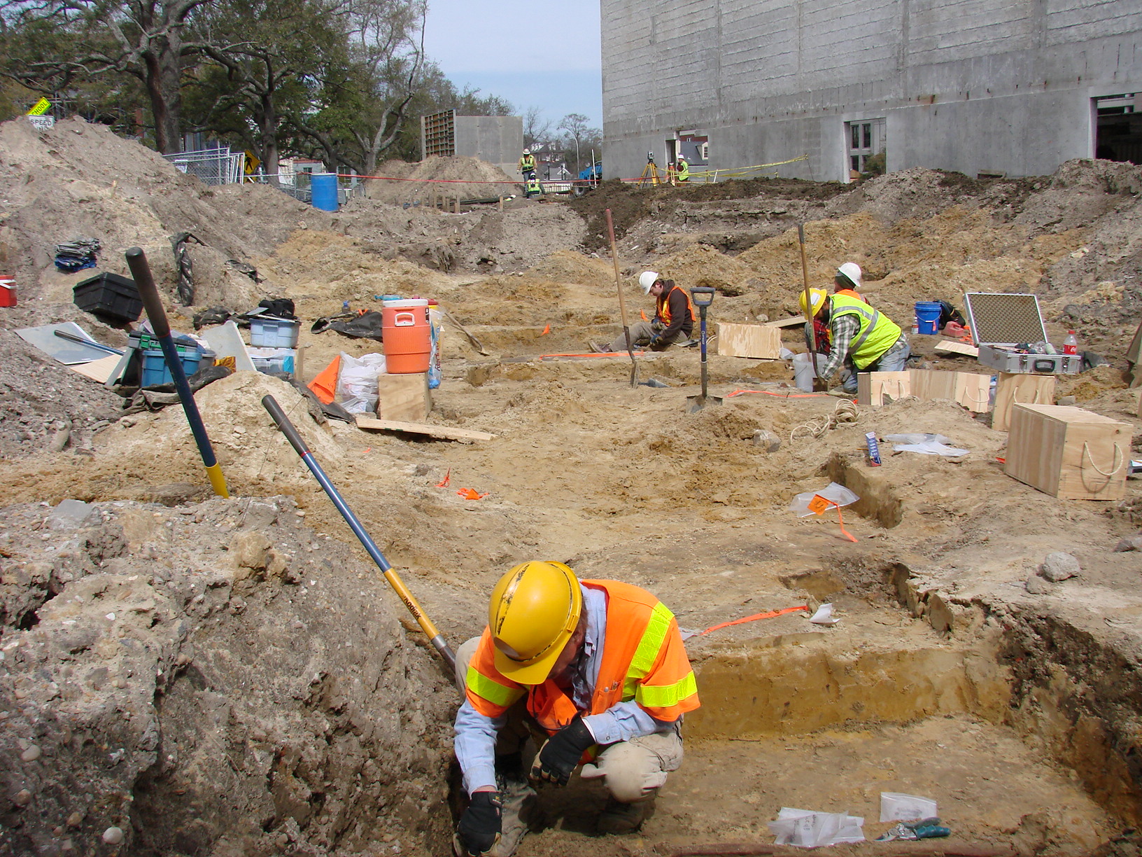 Archaeologist excavating graves - Poplin in foreground