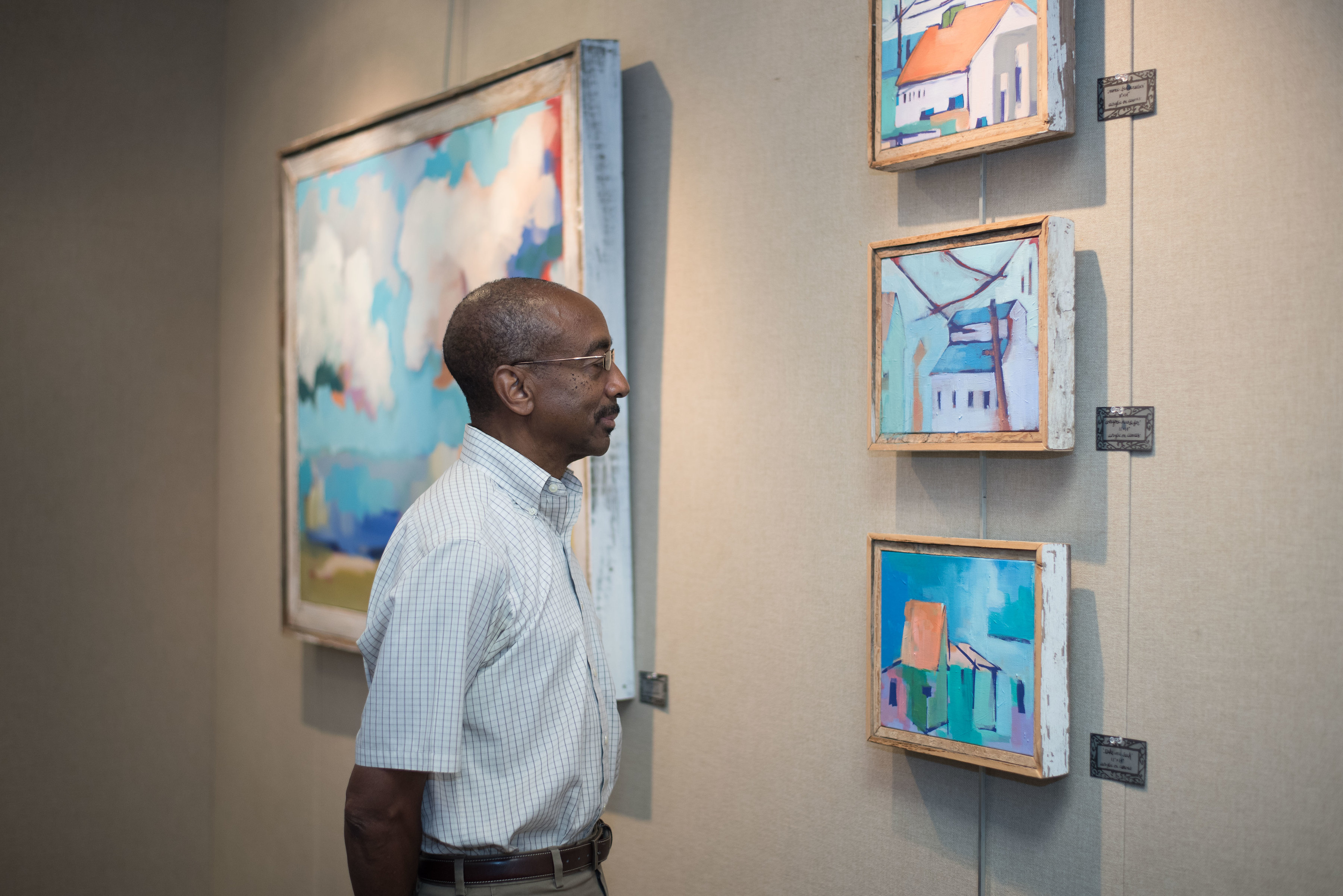 A patron viewing artwork at the Saul Alexander Gallery at Main Library.