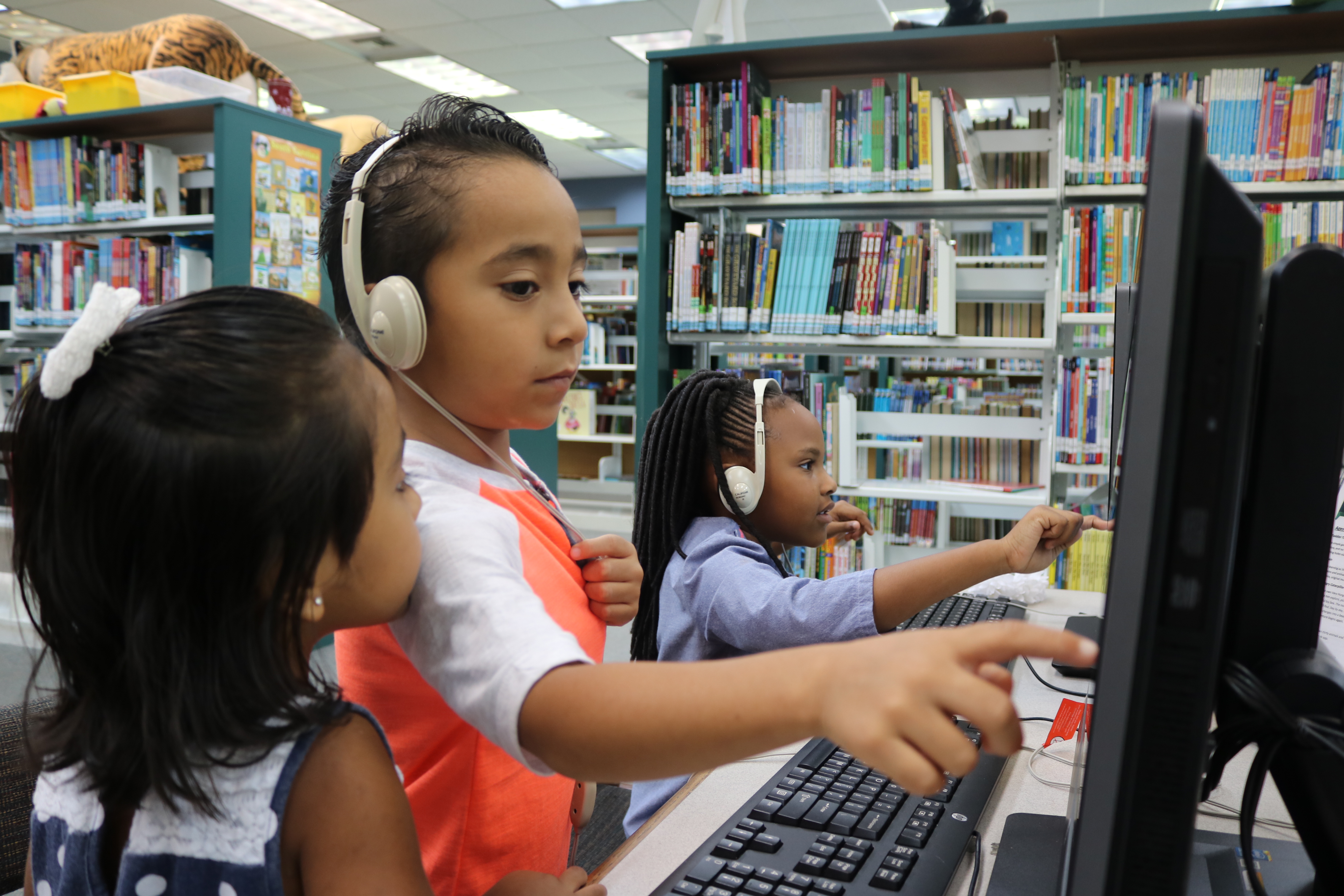 Children play on computers at Dorchester Road Regional Library