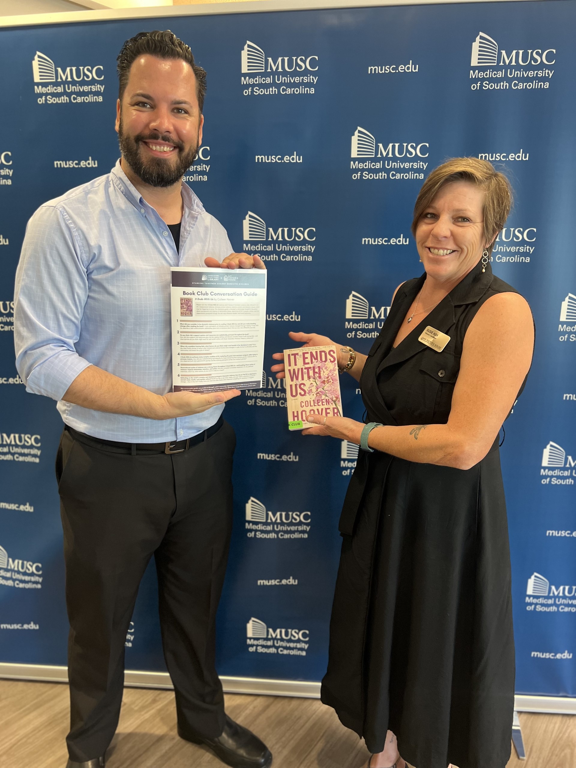 My Sister’s House employees Education Specialist Dan Glenn and Volunteer Coordinator Susie Ashe holding items from the kit during a press conference highlighting Domestic Violence Awareness Month and hosted by MUSC on Oct. 3, in partnership with My Siste