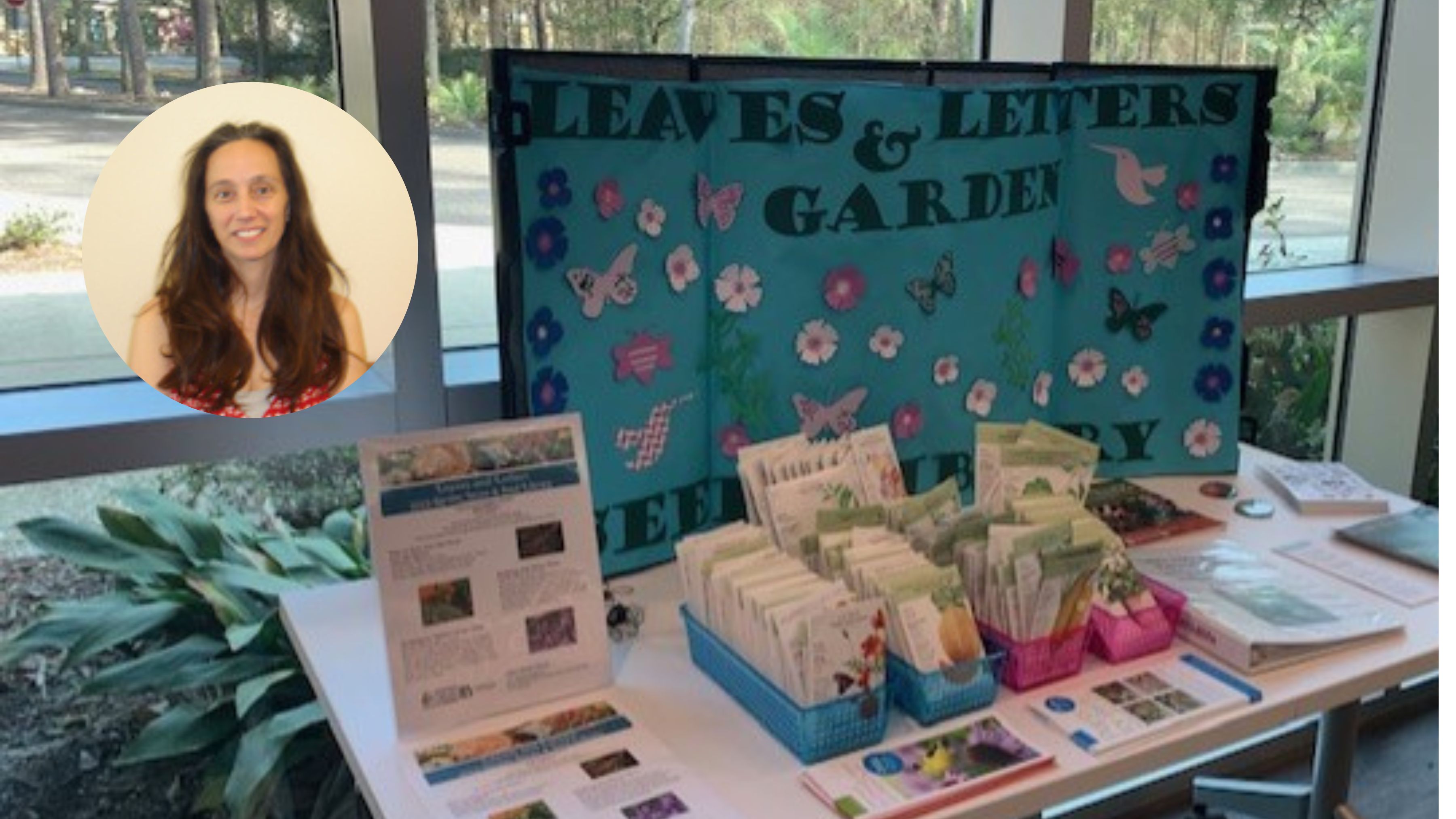 Photo of Librarian Michel Hammes with seed library display table