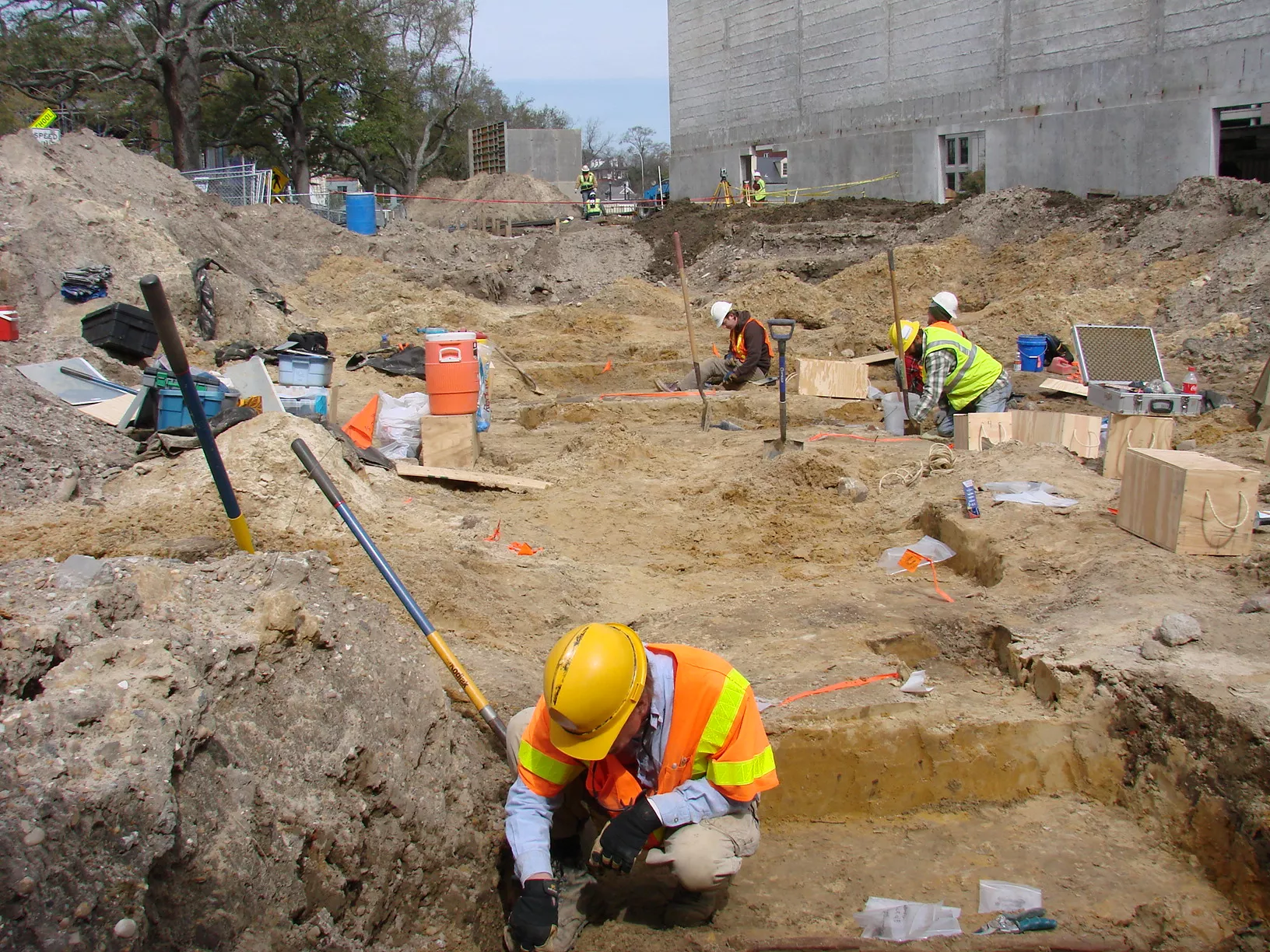 Archaeologist excavating graves - Poplin in foreground