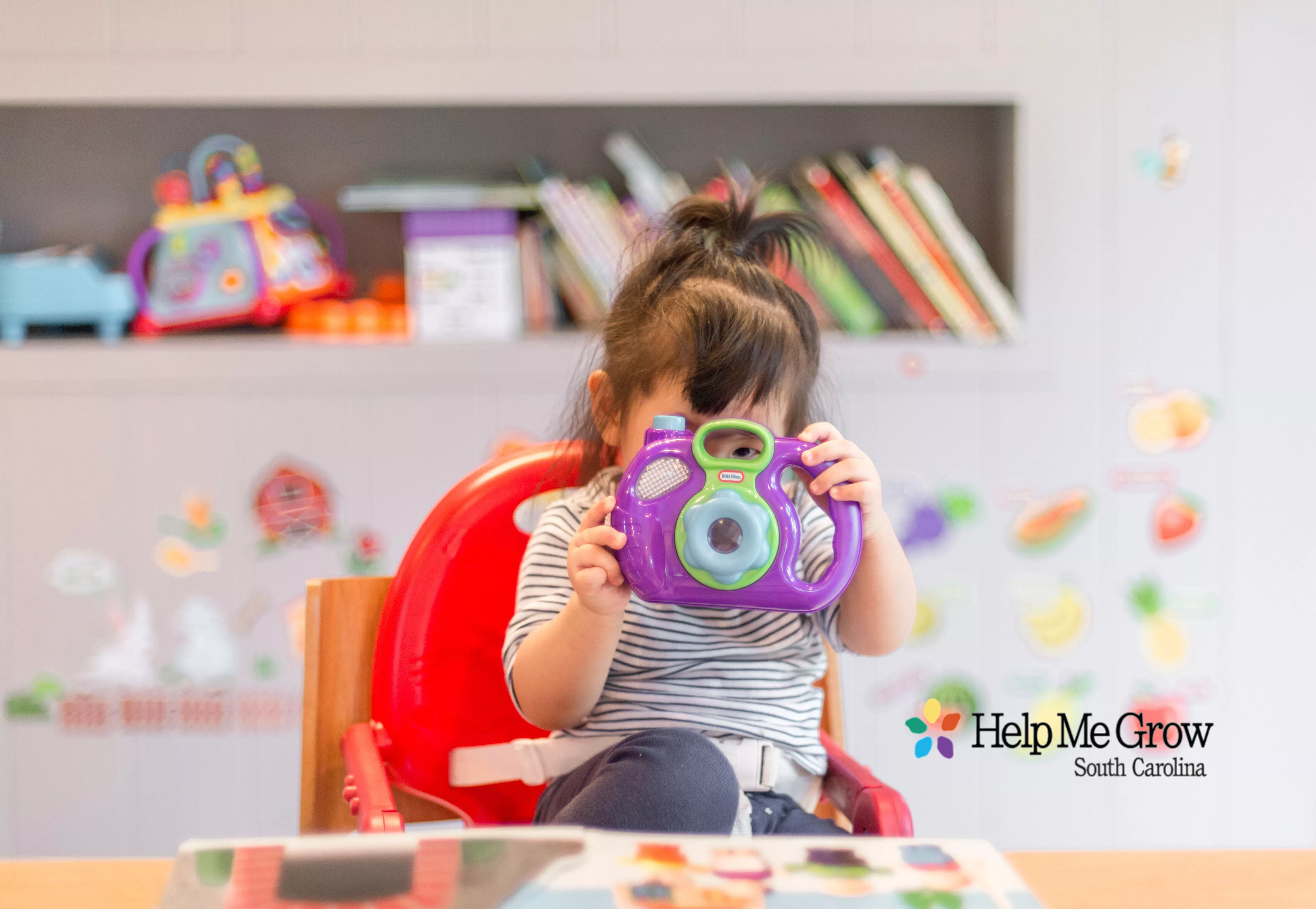 Toddler with Help Me Grow SC Logo - Read Rattle Roll