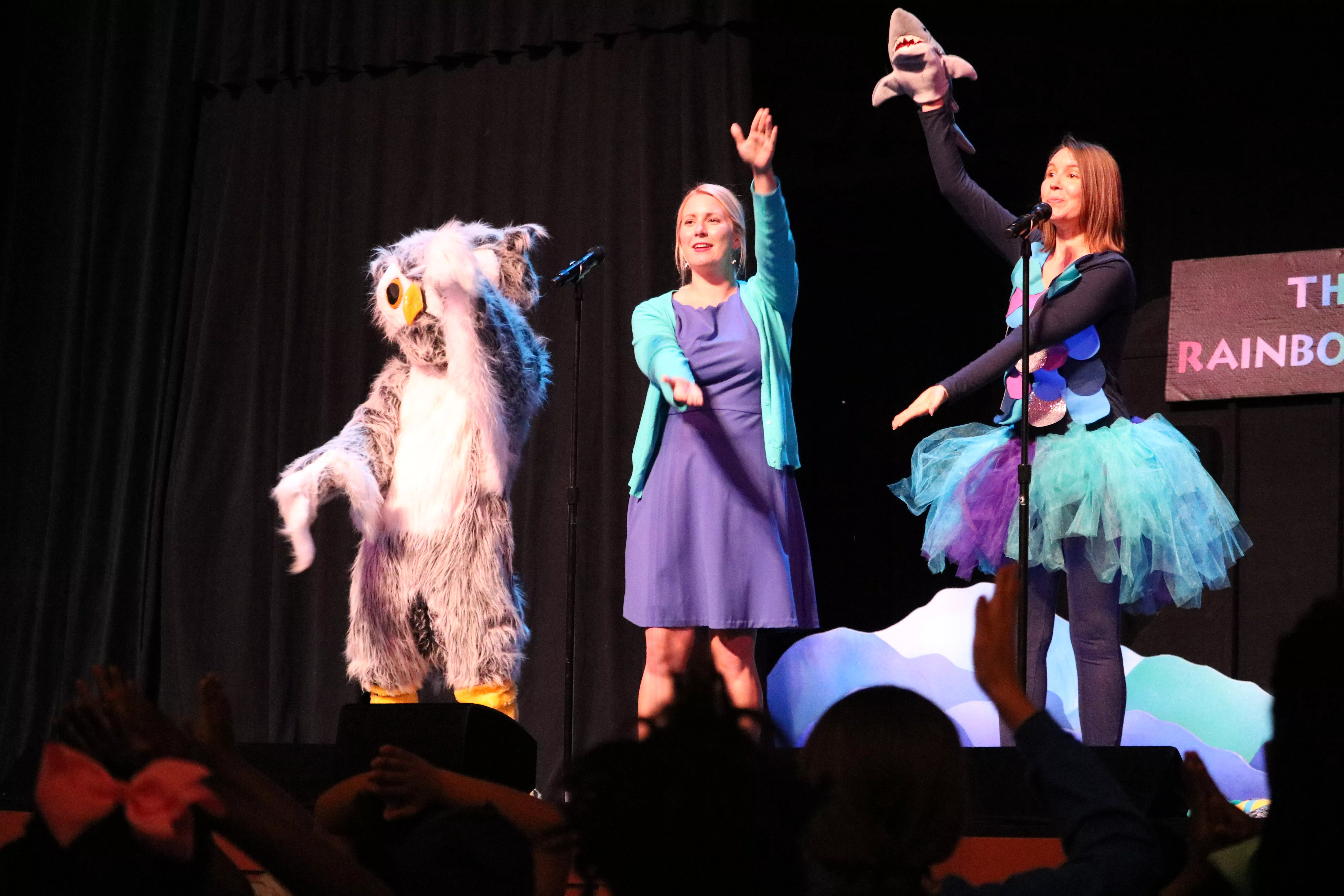 Devon, Jackie and Owlbert performing at the Gaillard Auditorium during an outreach