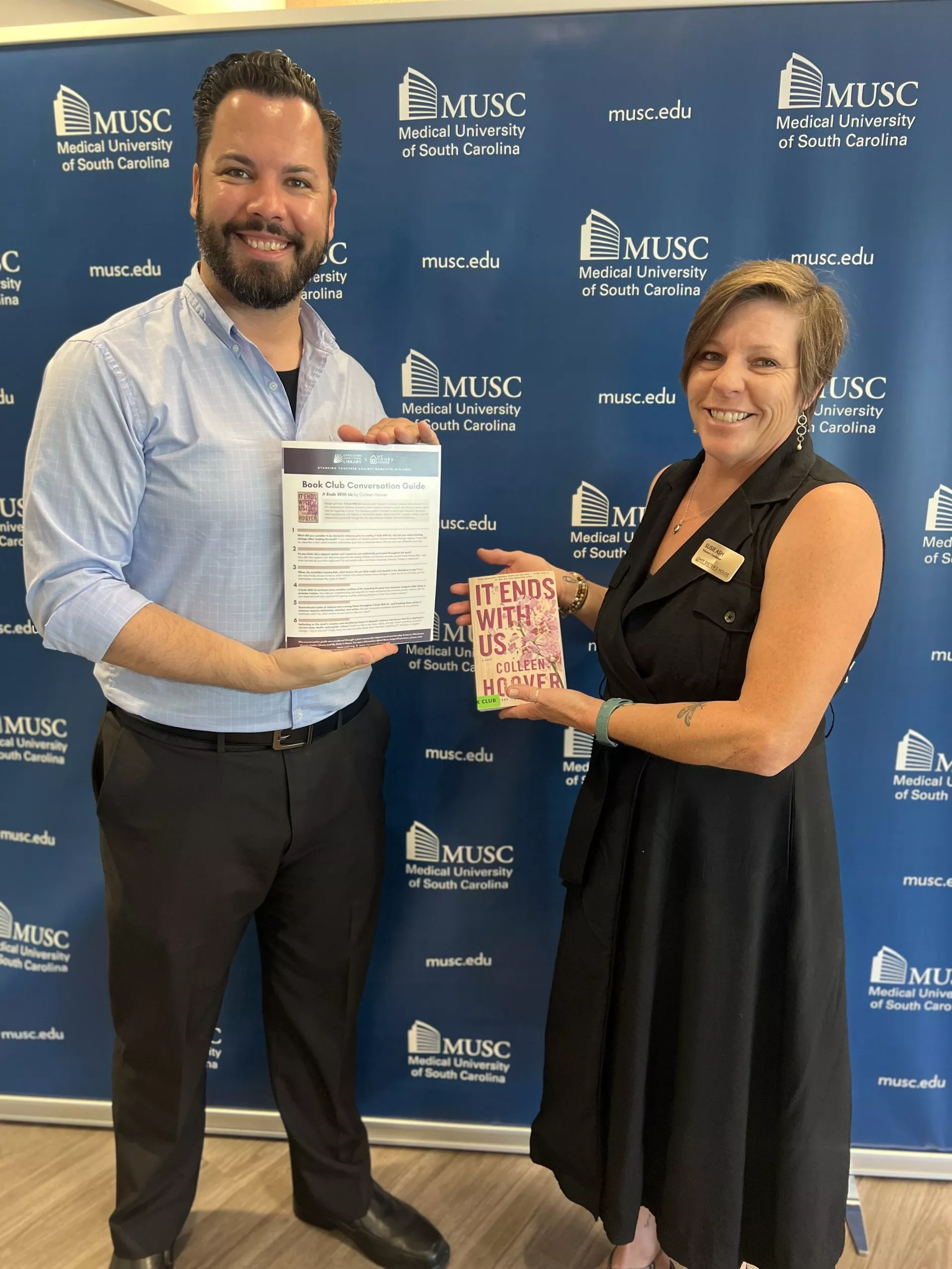  My Sister’s House employees Education Specialist Dan Glenn and Volunteer Coordinator Susie Ashe holding items from the kit during a press conference highlighting Domestic Violence Awareness Month and hosted by MUSC on Oct. 3, in partnership with My Siste